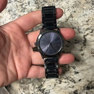 Michael Kors watch - no battery , no box. Wore until the battery died.